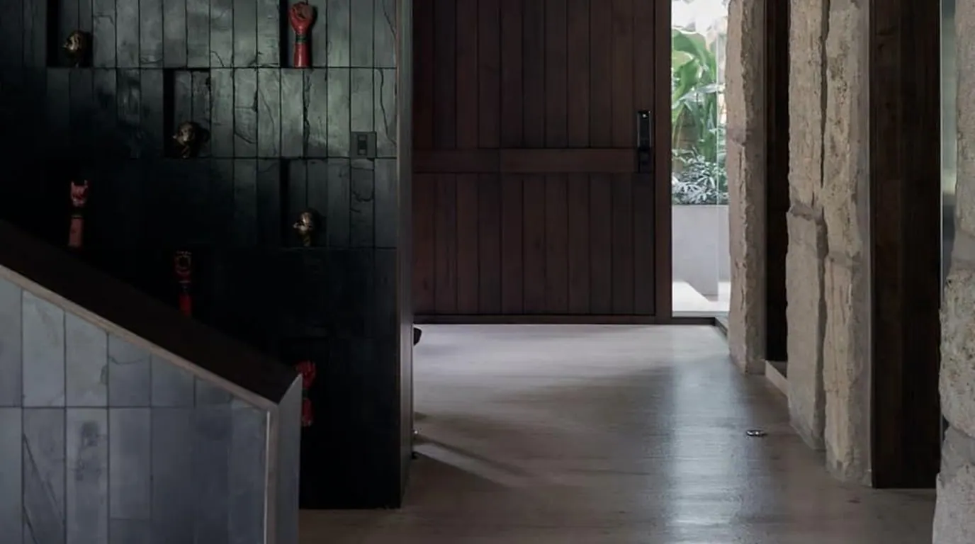 SHANTI entry passage with dark timber doors